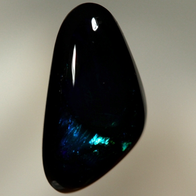 SOLID BLACK OPAL Rolling flashes of electric turquoise and peacock blue